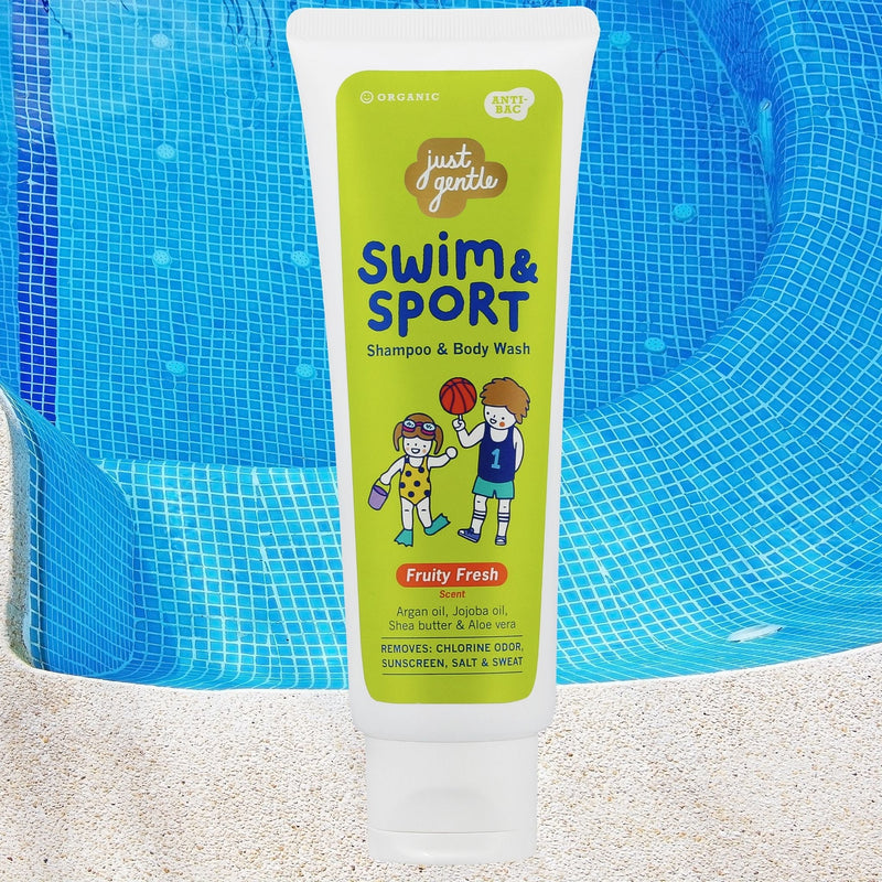 "Swim & Sport shampoo bottle floating above a pool with clear water and ripple reflections."