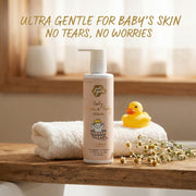 'Just Gentle' Baby hair and body wash bottle with a rubber duck and towel on a wooden surface, with text 'Ultra gentle for baby's skin, no tears, no worries'.