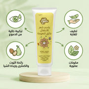 Tube of Just Gentle Kids' hair conditioner on a green background with icons and text.