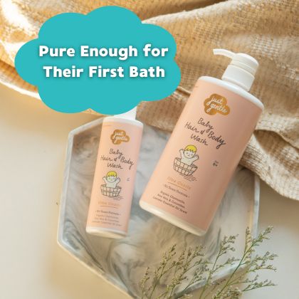 Just Gentle Baby hair and body wash bottles with cartoon illustrations on a wooden surface. Mobile view