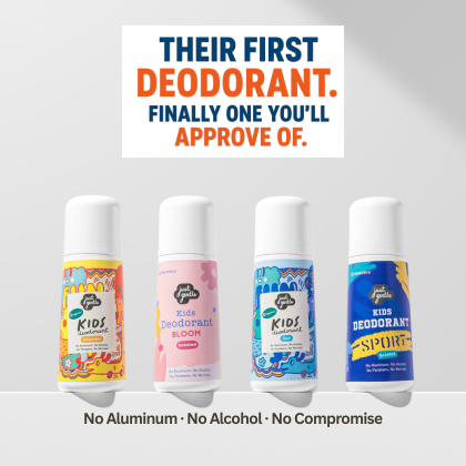 Four bottles of Just Gentle Kids' Deodorant with colorful labels on a gray background.