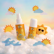 Two bottles of Just Gentle Baby & Kids Sun Protection cream with a sun-shaped plush toy on a cloud background.